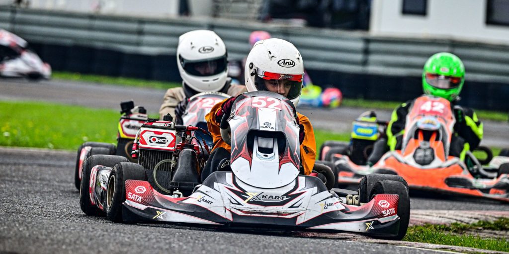 wet karting at clay pigeon raceway for the kart championship 2023 round 5 in a sailing splash suit yellow